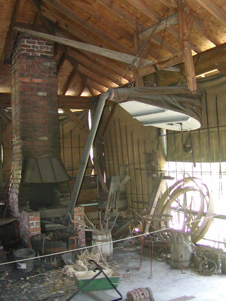 The forge and bellows inside the blacksmith shop