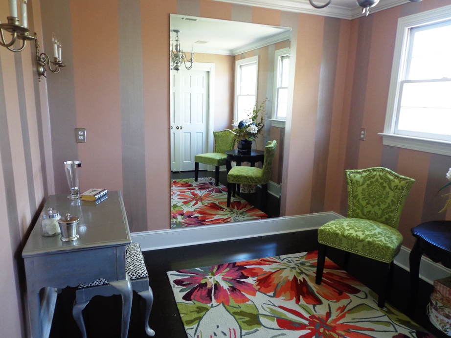 A furnished bridal suite with armchairs and a floral rug