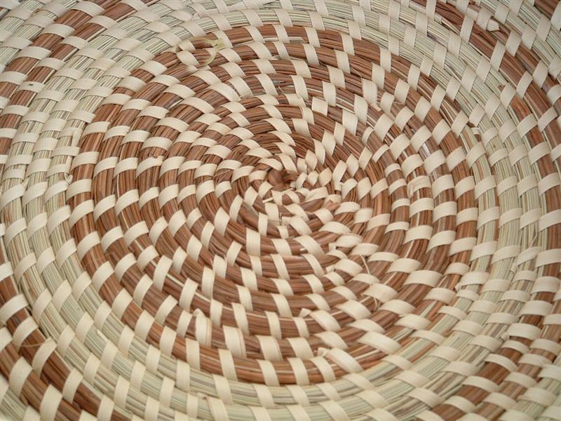 A coiled sweetgrass basket seen from above