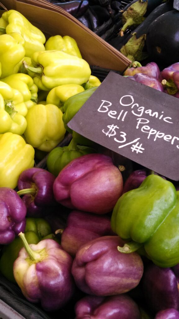 Organic bell peppers on a market stall